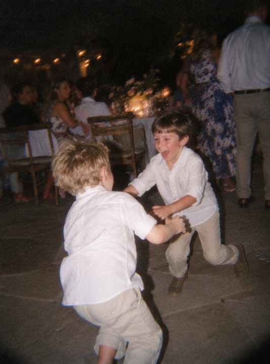 Two boys grinning at the camera